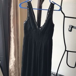 Black dress w/ beading at the top.